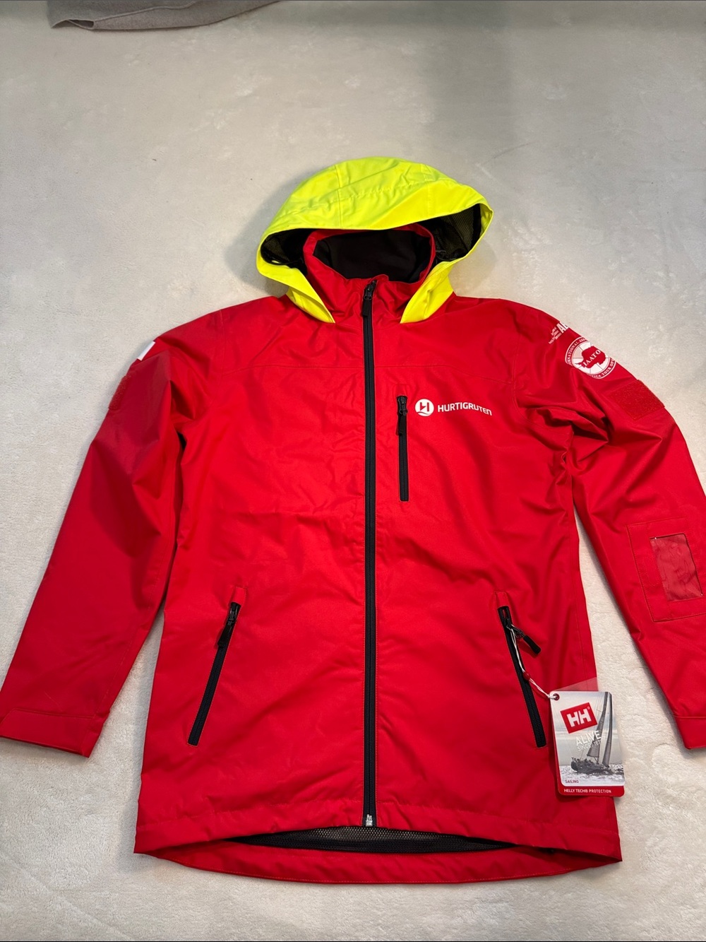 NWT Helly Hansen red waterproof sailing jacket with high visibility hood. XS.